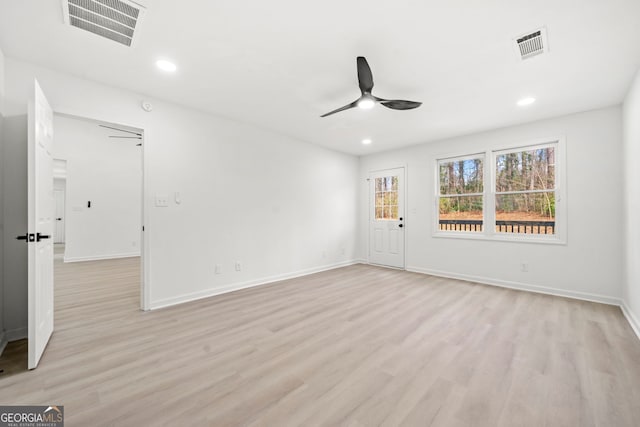 spare room featuring light wood finished floors, ceiling fan, visible vents, and recessed lighting