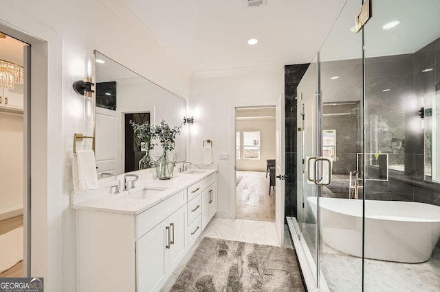1523 Grayson Pkwy, Grayson, GA 30017 - full bathroom featuring marble look tile flooring, double vanity, a freestanding tub, recessed lighting, and a shower stall