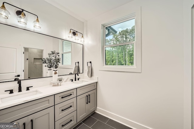 full bathroom with double vanity, a freestanding tub, connected bathroom, and a shower stall