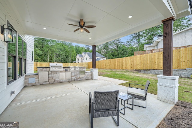 1523 Grayson Pkwy, Grayson, GA 30017 - fenced backyard featuring exterior kitchen, a patio, and a ceiling fan