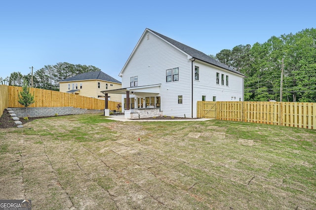 1523 Grayson Pkwy, Grayson, GA 30017 - back of house with a patio area, a fenced backyard, and a gate