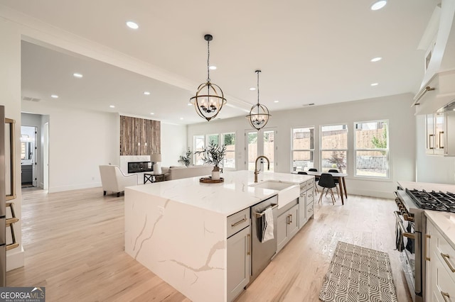 1523 Grayson Pkwy, Grayson, GA 30017 - kitchen with stainless steel appliances, light wood-style floors, plenty of natural light, light stone countertops, and recessed lighting