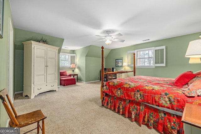 bedroom with light colored carpet, a ceiling fan, baseboards, vaulted ceiling, and visible vents