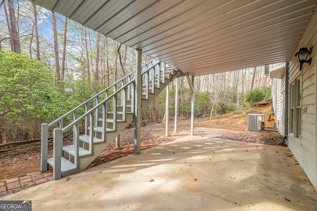 view of patio / terrace featuring stairs and central AC