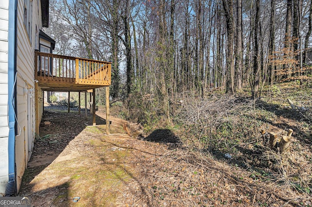 view of yard featuring a wooden deck