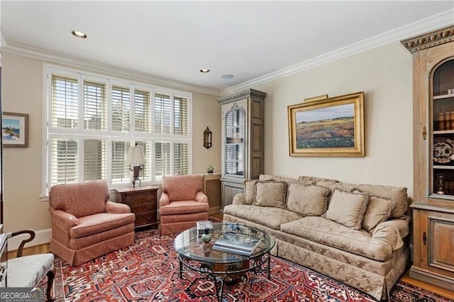 living room featuring recessed lighting, ornamental molding, baseboards, and wood finished floors