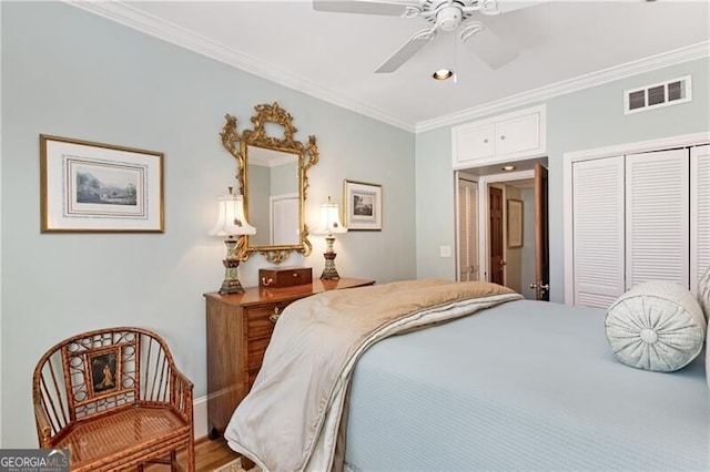 bedroom featuring ornamental molding, a closet, visible vents, and a ceiling fan