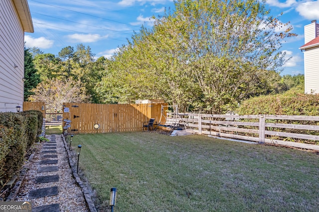 view of yard featuring fence private yard