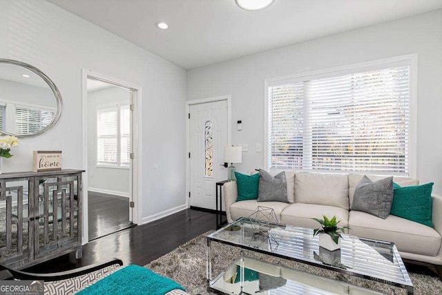 living room featuring dark wood-style floors, baseboards, and recessed lighting