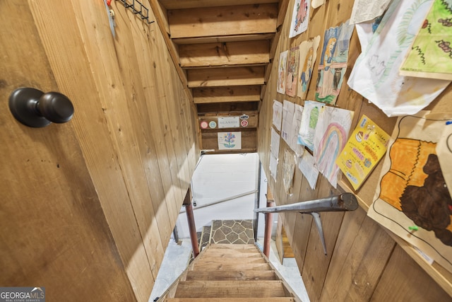 stairs with wood walls