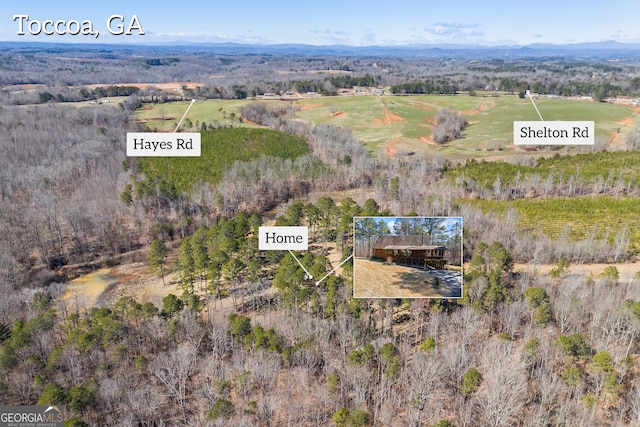 aerial view featuring a rural view and a mountain view