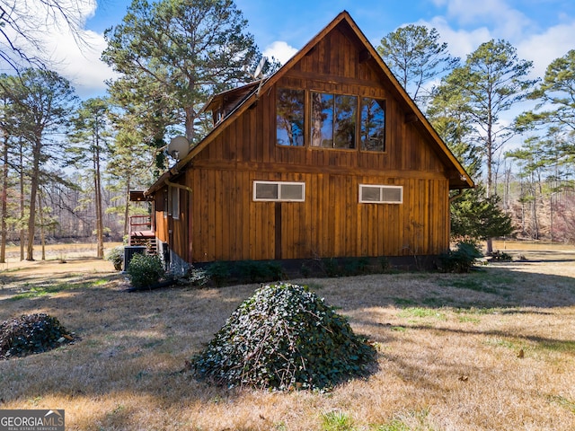 view of side of property with a yard