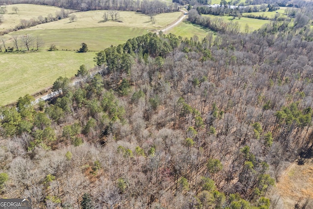 birds eye view of property featuring a rural view