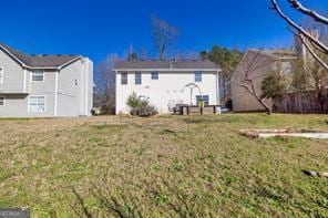 back of property featuring a yard