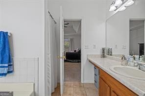 full bathroom featuring tile patterned flooring and vanity