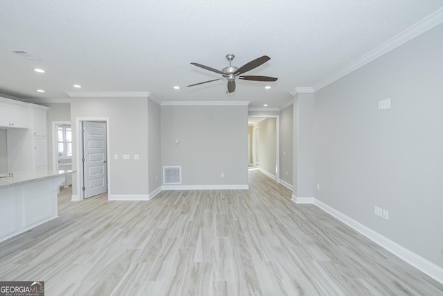 unfurnished living room with light wood finished floors, baseboards, visible vents, and a ceiling fan