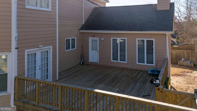 wooden deck featuring french doors and fence