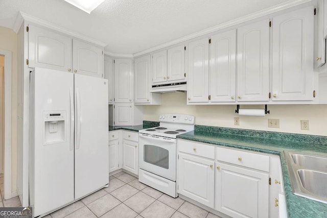 kitchen with light tile patterned flooring, under cabinet range hood, white appliances, white cabinets, and dark countertops