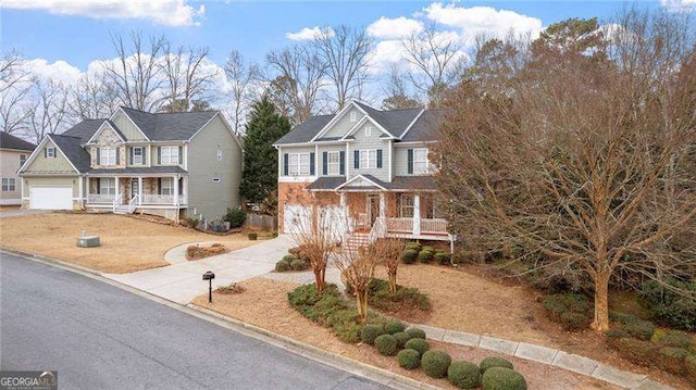 1657 Stilesboro Ridge Dr, Kennesaw, GA 30152 - craftsman-style home with covered porch, a garage, and concrete driveway