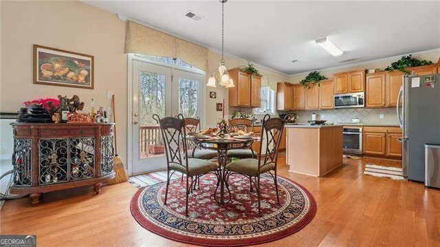 1657 Stilesboro Ridge Dr, Kennesaw, GA 30152 - dining room featuring light wood finished floors and a chandelier