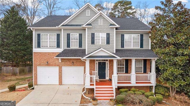 1657 Stilesboro Ridge Dr, Kennesaw, GA 30152 - view of front of property featuring covered porch, a garage, concrete driveway, a shingled roof, and brick siding