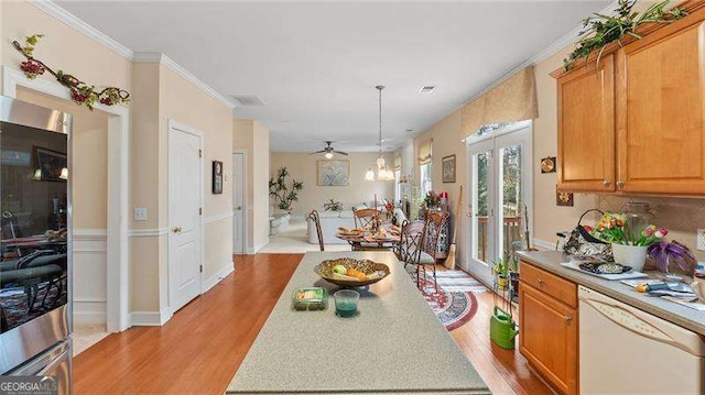 1657 Stilesboro Ridge Dr, Kennesaw, GA 30152 - kitchen featuring dishwasher, refrigerator, light wood finished floors, light countertops, and crown molding