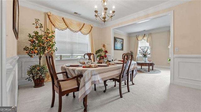 1657 Stilesboro Ridge Dr, Kennesaw, GA 30152 - dining room featuring a chandelier, light carpet, crown molding, a wainscoted wall, and a decorative wall