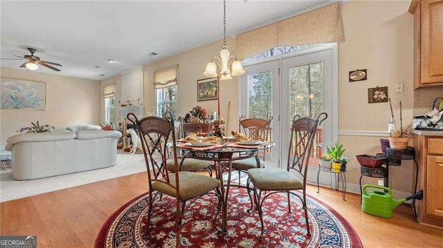 1657 Stilesboro Ridge Dr, Kennesaw, GA 30152 - dining room with light wood-style flooring, a chandelier, and ceiling fan