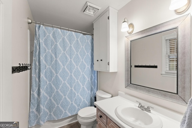 full bathroom featuring visible vents, vanity, and toilet