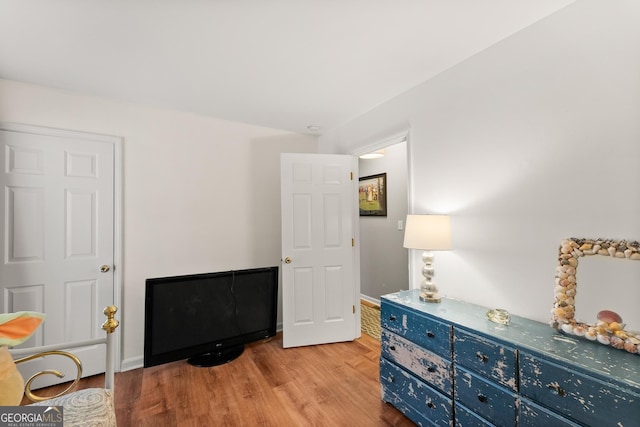 sitting room featuring light wood-style flooring and baseboards