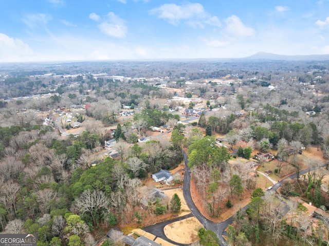 birds eye view of property with a mountain view