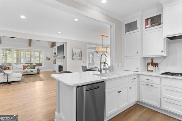 kitchen featuring a sink, light countertops, and stainless steel dishwasher