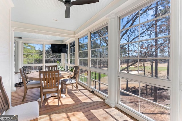 sunroom featuring ceiling fan