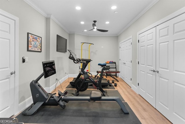 workout room featuring recessed lighting, crown molding, baseboards, and wood finished floors