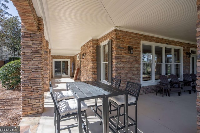 view of patio featuring outdoor dining area