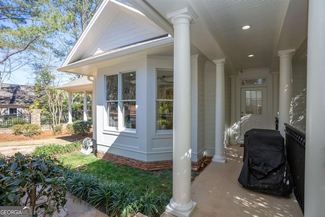 view of side of home with fence