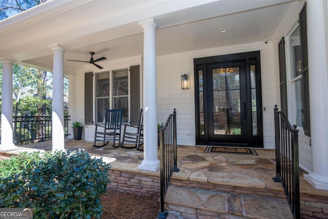 view of exterior entry with covered porch and a ceiling fan