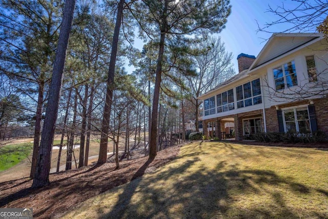 view of yard featuring a sunroom