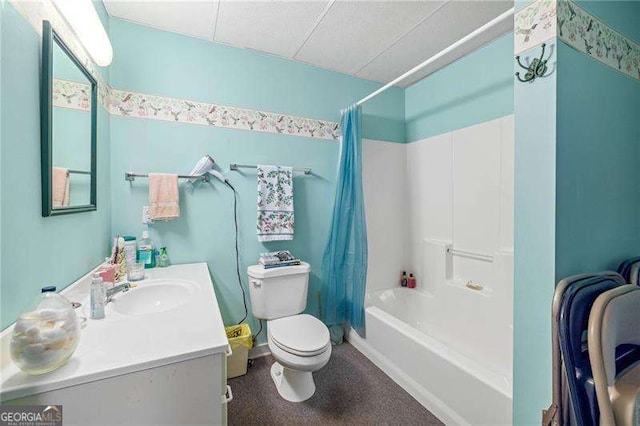 bathroom featuring toilet, vanity, and shower / bathtub combination with curtain