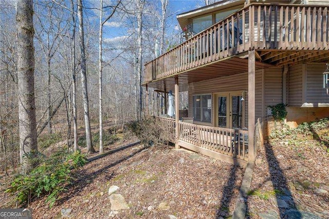 view of side of property with a wooden deck