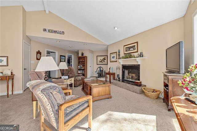 living room featuring high vaulted ceiling, a glass covered fireplace, light carpet, and beamed ceiling