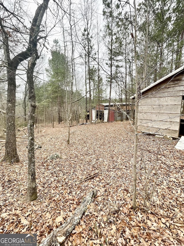 view of yard with an outbuilding and a pole building