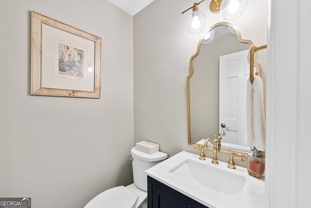 bathroom with vanity and toilet