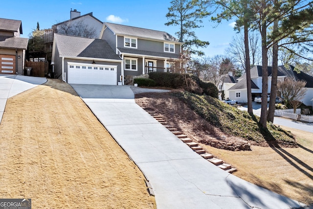 view of front of home with a chimney, a porch, fence, a garage, and driveway