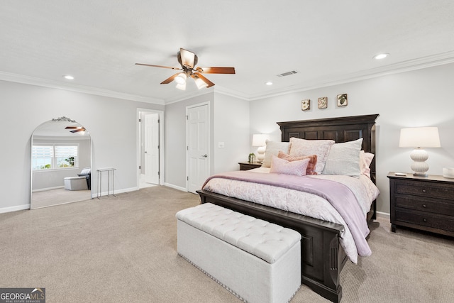 bedroom featuring baseboards, visible vents, and crown molding