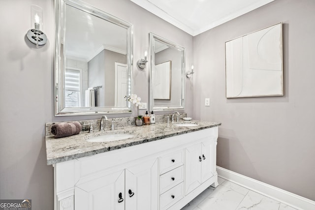 full bathroom with crown molding, marble finish floor, a sink, and baseboards