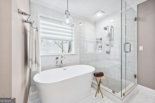 full bathroom featuring a stall shower, marble finish floor, a soaking tub, and baseboards