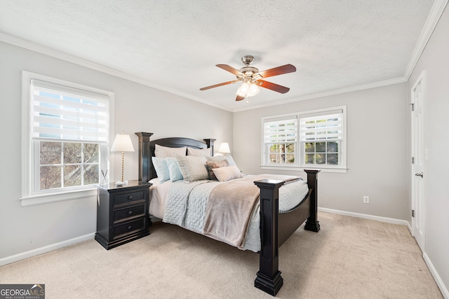 bedroom featuring baseboards, a ceiling fan, light colored carpet, ornamental molding, and a textured ceiling