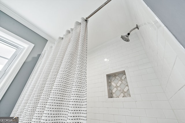 interior details with a tile shower