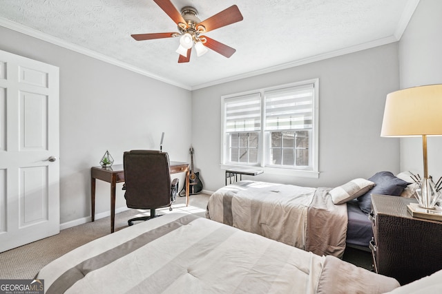 carpeted bedroom with a textured ceiling, ornamental molding, a ceiling fan, and baseboards